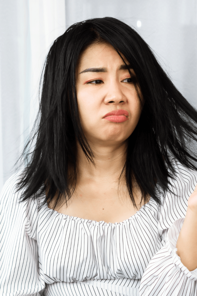 woman has thinning hair after menopause