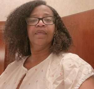 me waiting to get mammogram, gown on