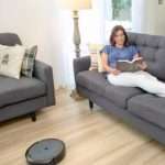 Woman Lying on Couch while Reading Book
