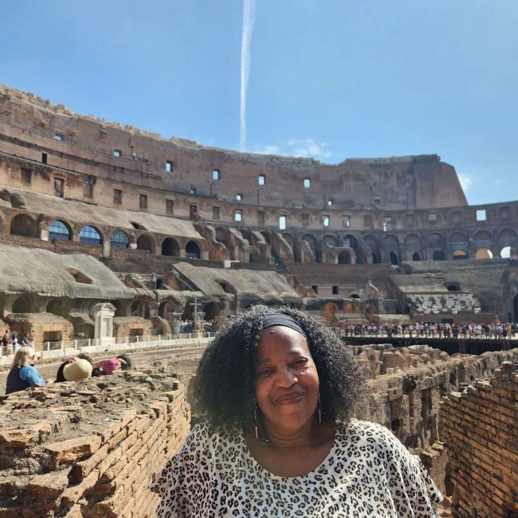 picture of me behind the colosseum in Rome