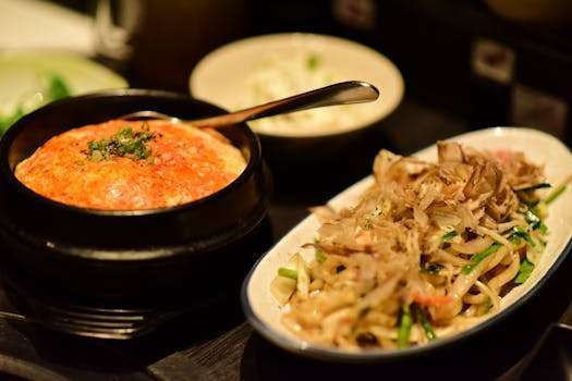 Tantalizing Japanese cuisine featuring a flavorful ramen and rice dish served in bowls.